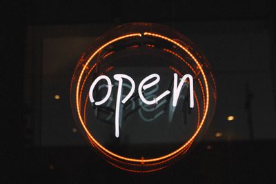 White and orange open neon signage turned on.