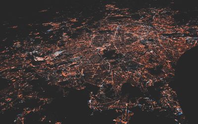Lighted city at night via an aerial photo.