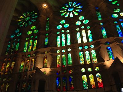 A stained glass window of blue in La Sagrada Familia, an ornate church in Barcelona, Spain.