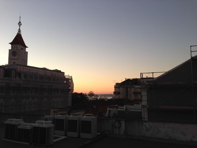 A view from the Surf Office in Lisbon at sunrise over the city.