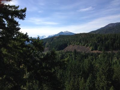 An overlook near Brandywine Falls in Whistler, British Columbia. It shows a forest with a mountain the background.