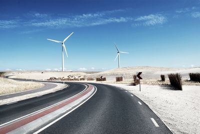 Road that curves into horizon.